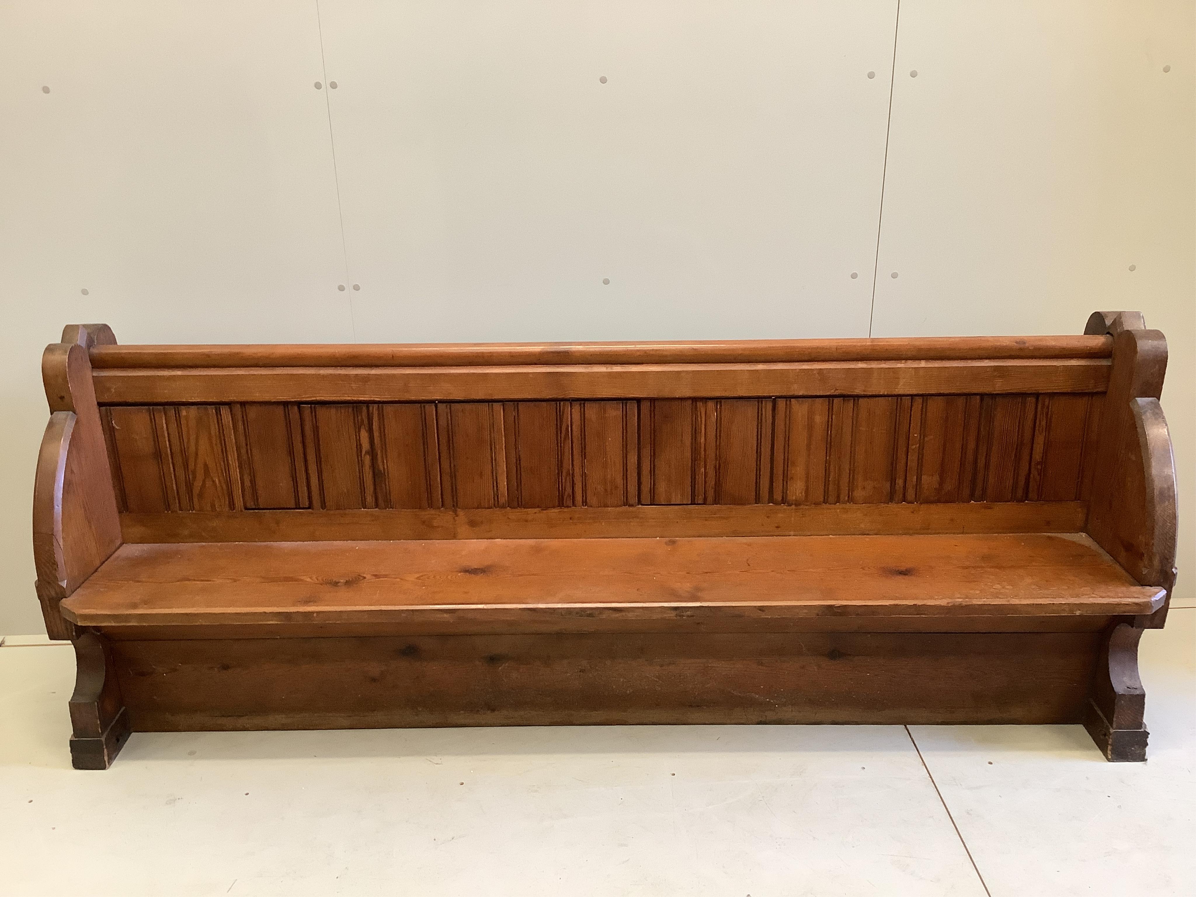 A Victorian pitch pine pew, width 223cm, depth 46cm, height 80cm. Condition - fair